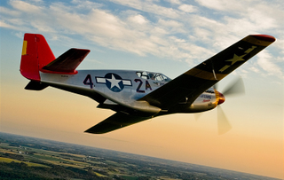 A restored P-51C Mustang with the distinctive red tail of the 99th Pursuit Squadron (Max Haynes)